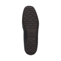 Bottom view of navy blue Cortizia women's loafer shoe on a white background showing high grip rubber black sole
