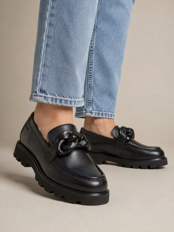 a pair of black sioux shoes for women